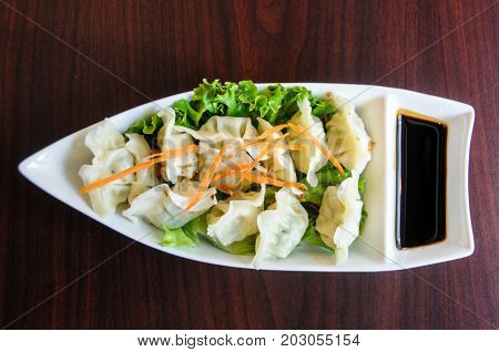 Veggie Potstickers, steamed vegetable dumplings with sweet soy sauce