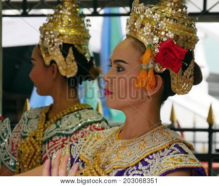 BANGKOK, THAILAND--Two female cultural dancers who perform at the Erawan Shrine to pay homage to the victims of the bombing in 2015 at Pathum Wan District, Bangkok. Photo taken in March 2016.