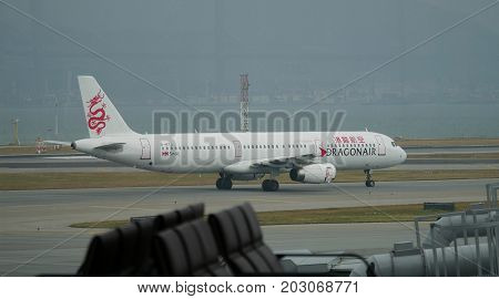 HONG KONG--A Dragon Air plane gets ready to take off from the runway of the Hong Kong International Airport in Chek Lap Kok in December 2016.