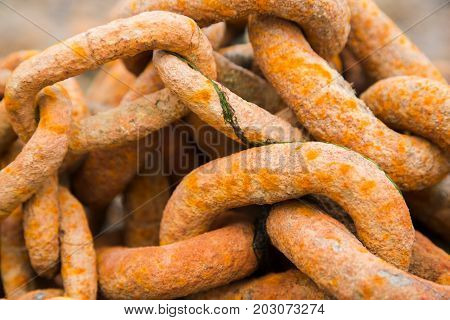 Old rusty heavy iron chain links, close-up