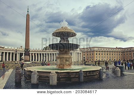 VATICAN ROME ITALY - NOVEMBER82016 : large number of touist walking in front of St. Peter's Basilica vatican rome italy