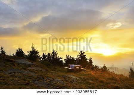 Sunrise In The Mountains And Wooden Table