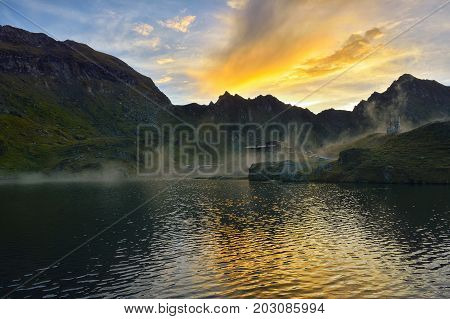 Beautiful sunset over Balea Lake Transfagarasan Romania