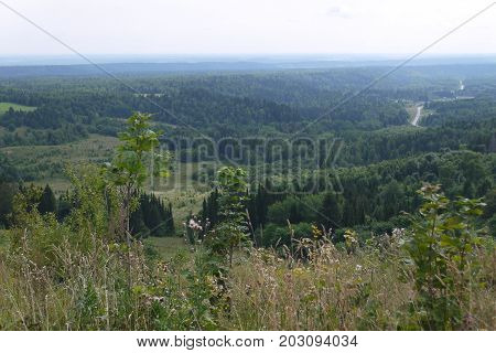 View from the mountain on the woody area in the Urals