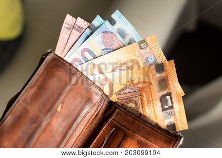 Euro bills in a wallet. Leather wallet.