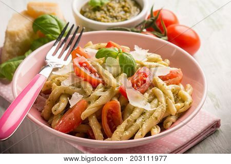 pasta with pesto  tomato e parmesan cheese flake, selective focus