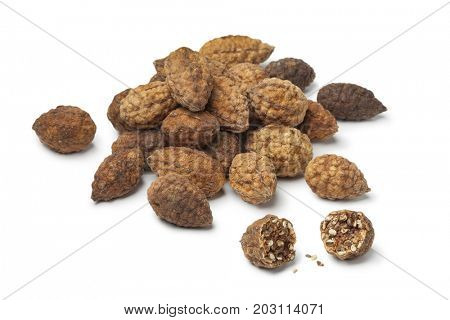 Heap of dried caperberries on white background