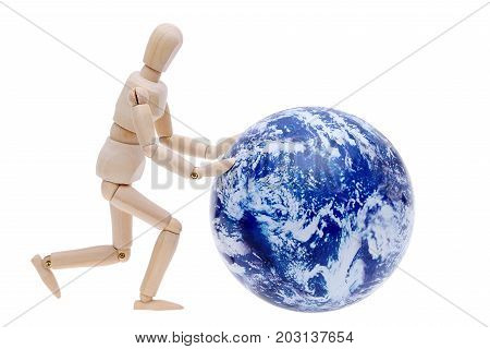 wooden model dummy hand rolling globe isolated on white background