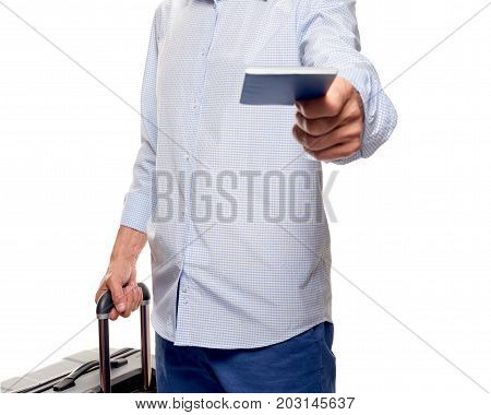 Happy young tourist with passport and valise at border control. part of man