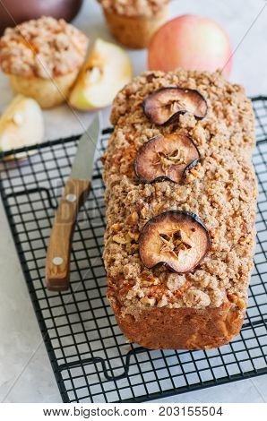 Holland Apple Crumble Bread Served On A Wire Rack On A White Stone Background. Close Up And Copy Spa