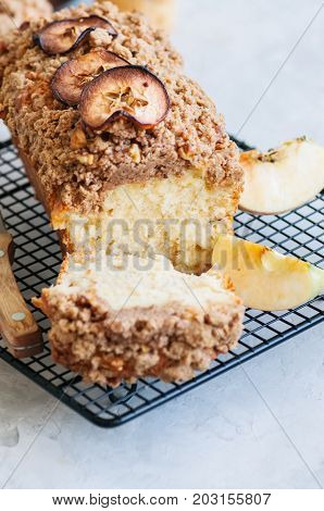 Holland Apple Crumble Bread Served On A Wire Rack On A White Stone Background. Close Up And Copy Spa