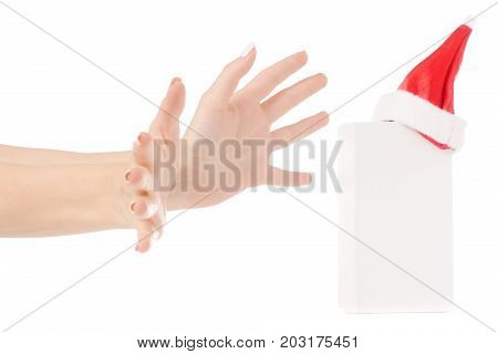 A female hand holding a box of a Santa Claus hat a gift on a white background isolation