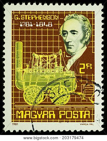 Moscow Russia - September 07 2017: A stamp printed in Hungary shows George Stephenson and old locomotive dedicated to the 200th Anniversary of the Birth of George Stephenson 1781-1848 circa 1981