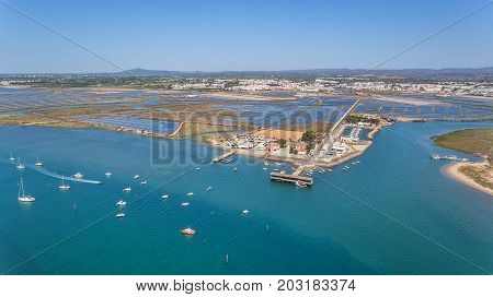 Aerial. The pier in the bay, the four waters of Tavira Island. Quatro aguas