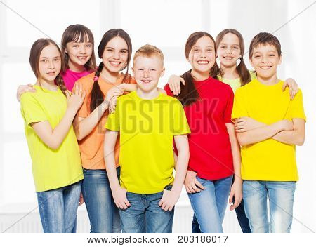 Happy group children in school. Smiling teen. Friedship boys and girls