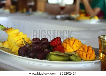 Fruits dessert with mango, grapes, kiwi and strawberres