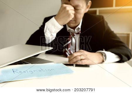 Businessman feel sad Disappointed when recived white envelope resignation
