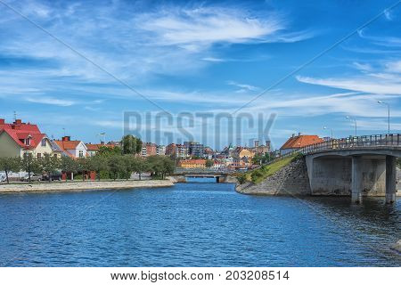 KARLSKRONA SWEDEN - 2017 July. Typical red Swedish wooden houses with natiaonal flag in the city of Karlskrona.