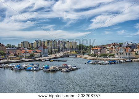 KARLSKRONA SWEDEN - 2017 July. Typical red Swedish wooden houses with natiaonal flag in the city of Karlskrona.