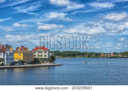 KARLSKRONA SWEDEN - 2017 July. Typical red Swedish wooden houses with natiaonal flag in the city of Karlskrona.