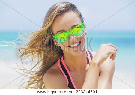 A Young, Portrait Of Blonde In Green Glasses