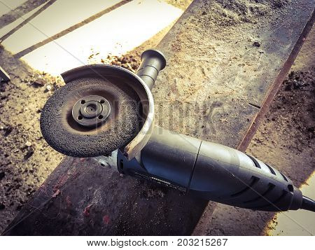 close of photo of used angle grinder.