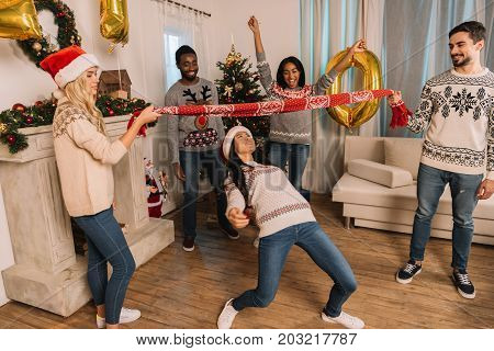Multiethnic Friends Playing Limbo Game
