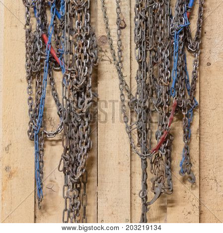Old Snow Chains Hanging In A Barn