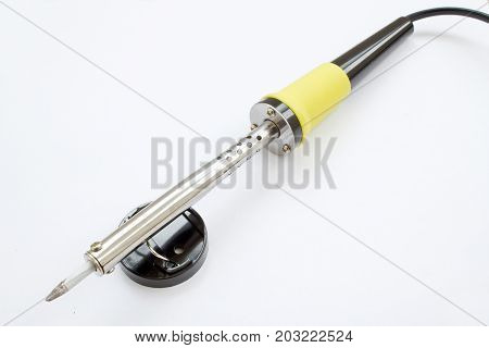 Soldering iron on white background. closeup shot