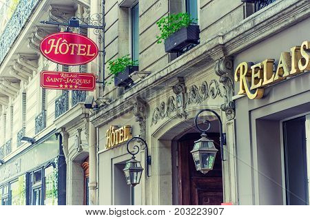 Paris, France - June 4, 2017: Upper part of four stars hotel Relais Saint Jacques entrance. It's name was made with golden letters