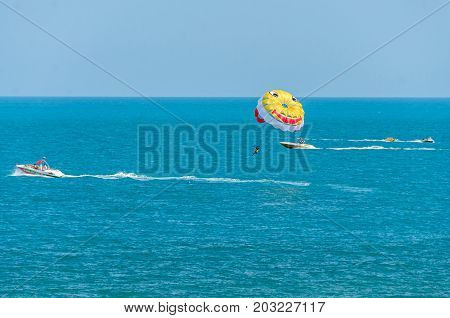 Albena, Bulgaria - June 15, 2017: Colored Parasail Wing Pulled By A Boat In The Sea Water, Parasaili
