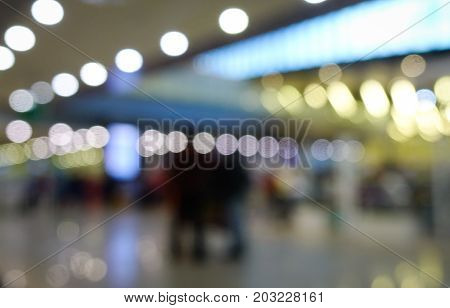 Blurred background in the departure hall of airport with bokeh
