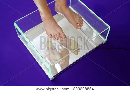 Healthy feet, orthopedic examination in the direction of valvis. Female feet during a podoscopic examination in an orthopedic surgery.
