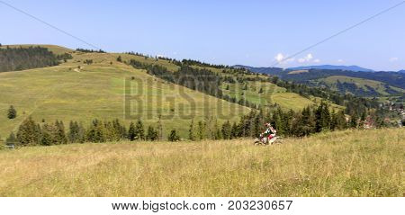 Motorcyclist on Carpathian Mountainss extreme sport active lifestyle adventure touring concept