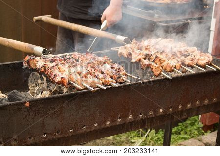 making kebabs on the street at the holiday meal