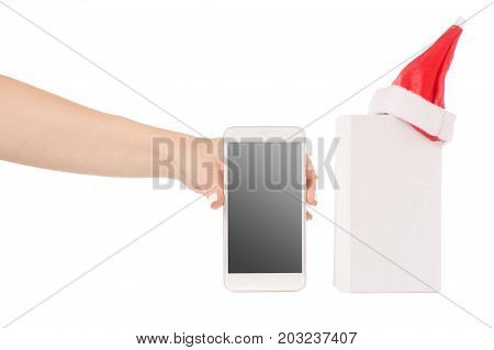 Female hand holding a mobile phone smartphone box Santa hat frost gift on a white background isilation