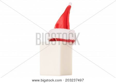 White candle Santa Claus hat isolated on white background isolation