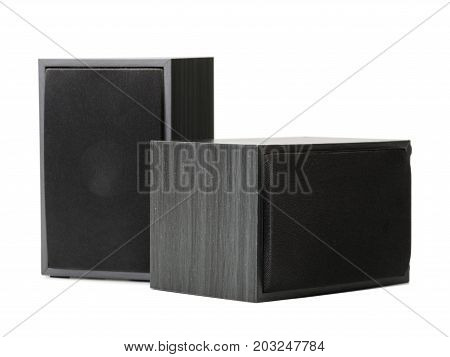A close-up picture of two big black vintage loudspeakers isolated on a white background. Audio equipment for sound quality. Entertainment, technology, music concept.