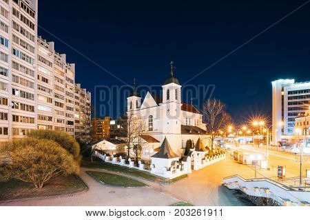 Minsk, Belarus - April 3, 2017: Evening Night View Of Cathedral of the Holy Apostles Sts Peter and Paul On Illuminated Nemiga Street. Temple of the Belarusian Exarchate of the Russian Orthodox Church