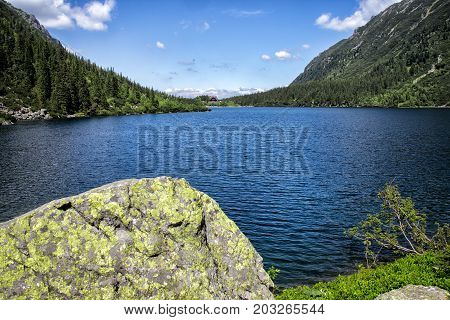 Morskie Oko lake with rocks under water at Tatra Mountains, Poland.