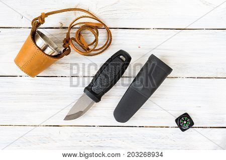 Composition Of A Knife And A Compass On A White Background.