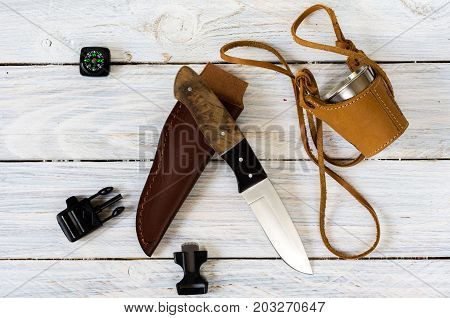 Knife, Glass, Compass And Flint To Get A Spark. White Background.