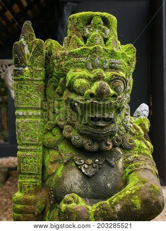 Rakasa Balinese Stone Sculpture Covered With Moss.