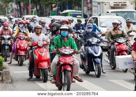 HO CHI MINH CITY (SAIGON), VIETNAM - JULY 2017 : Road traffic in Saigon, Vietnam. In the biggest city in Southern Vietnam are more than 4 mil. motorbikes, the traffic is often congested