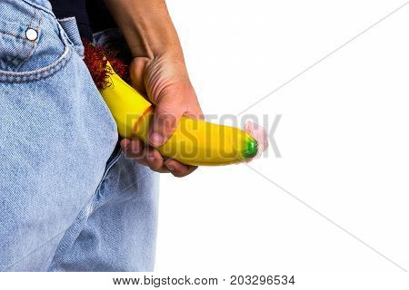 A Big Banana Sticks Out Of A Blue Jean Demonstraiting A Penis With A Piece Of Condom