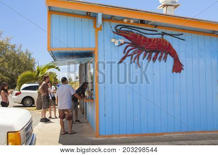 Ohau - June 2012: Tourist waiting  in this tipical restaurant on the road for eating  lake shrimps fished in the same day that are very tasty