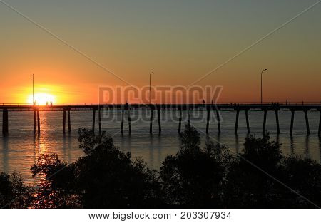 sun setting behind the wharf, Derby, Western Australia.