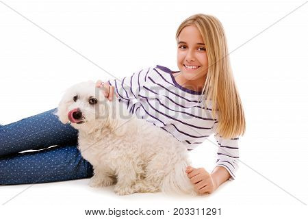 happy lovely girl laying on the floor with maltese dogisolated over white background