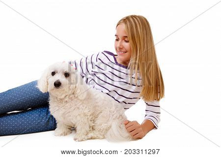 happy lovely girl laying on the floor with maltese dogisolated over white background