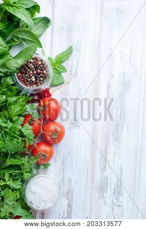 Tomatoes And Bunch Of Fresh Green Basil On A  Wood Background,